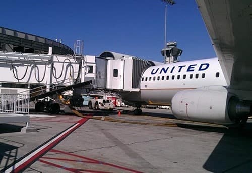 United Airlines plane parked at the airport gate.
