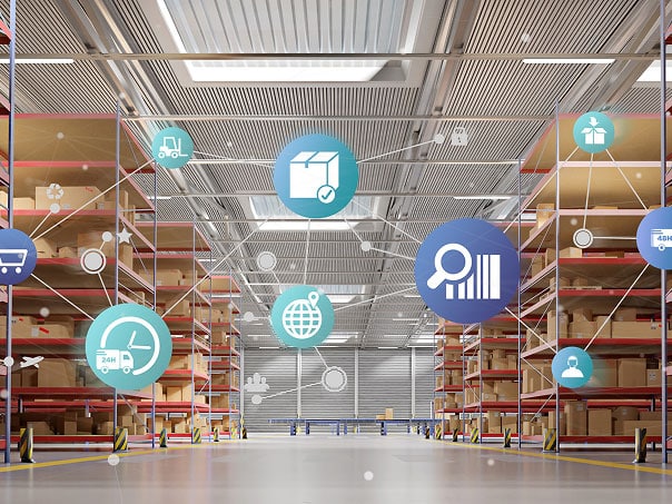 Warehouse interior with logistics icons suspended from ceiling, representing supply chain and distribution.